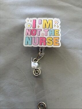 Colorful "I'M NOT THE NURSE" Badge Reel